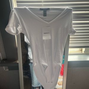 this white bodysuit is from forever 21. brand new still has a tag